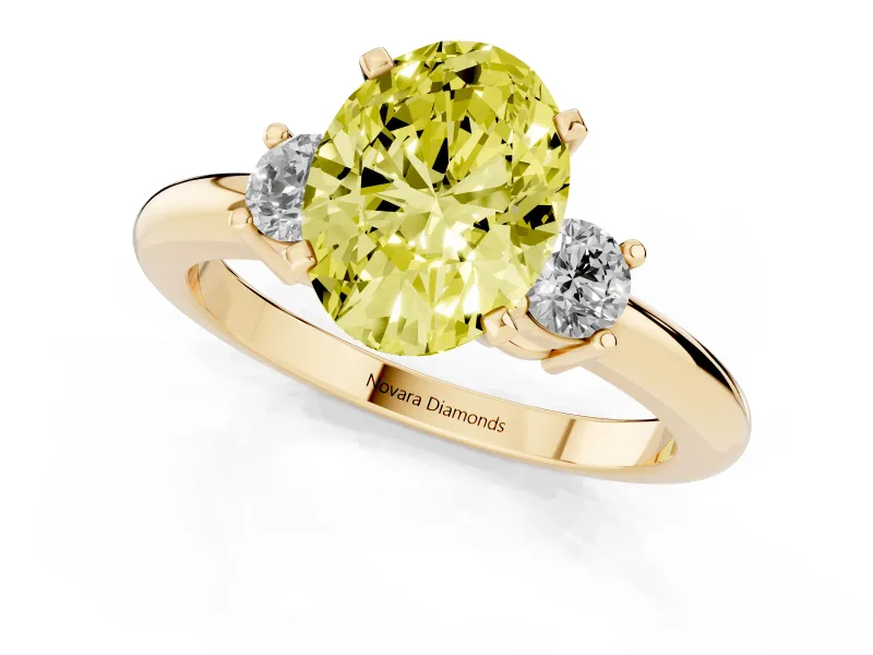 Fancy Yellow Three-Stone Oval Cut Diamond Ring Set in Yellow gold with Prong Setting and Plain Band