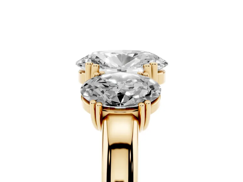 Oval Cut Diamond Three-Stone Ring Set in Yellow gold with Polished Band and Prong Setting