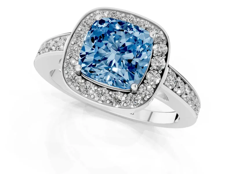 Fancy Blue Cushion Cut Diamond Halo Pavé Engagement Ring Set in White gold with Bezel Setting