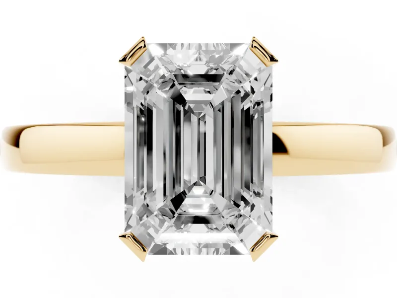Emerald Cut Diamond Solitaire Ring Set in Yellow gold with Prong Head and Smooth Polished Band