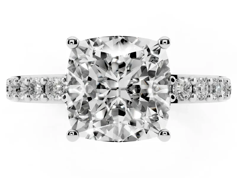 Cushion Cut Diamond Solitaire Set in Silver with Round Pavé Band and Prong Setting