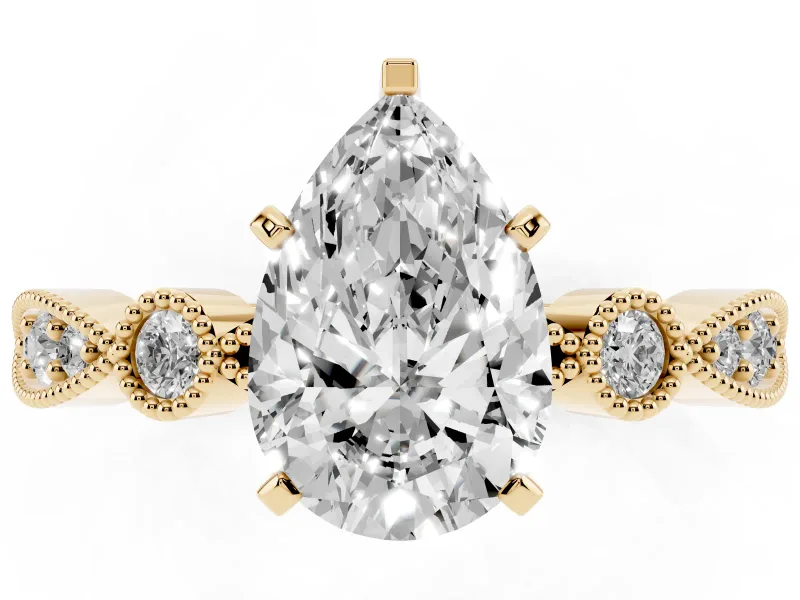 Pear Cut Diamond Solitaire Engagement Ring Set in Yellow gold with Milgrain Bezel Accent Band