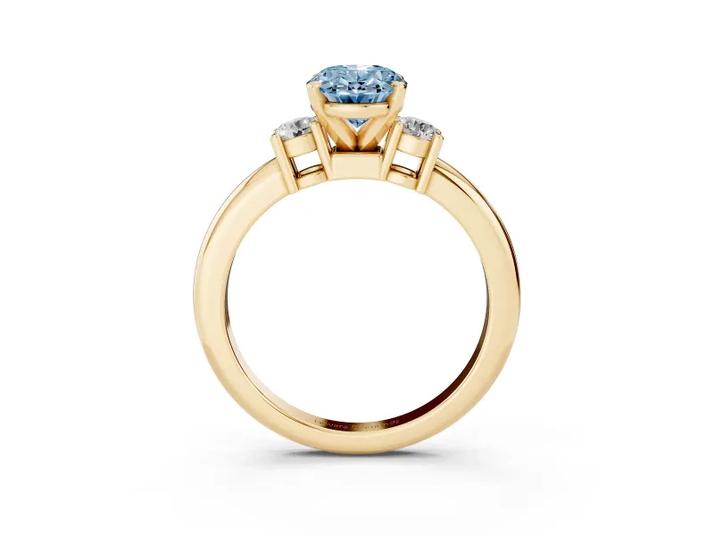 Fancy Blue Three-Stone Oval Cut Diamond Ring Set in Yellow gold with Prong Setting and Plain Band