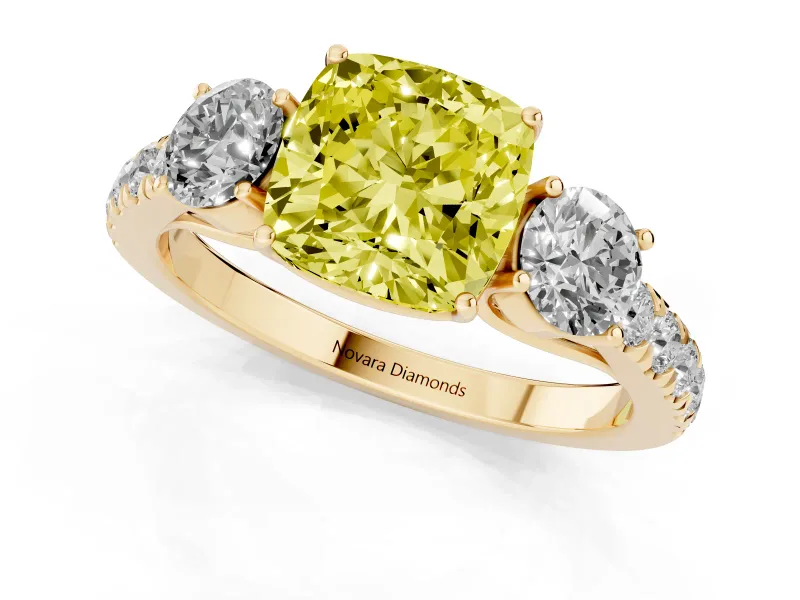 Fancy Yellow Cushion Cut Diamond Three-Stone Ring Set in Yellow gold with Round Side Stones and Delicate Pavé Band