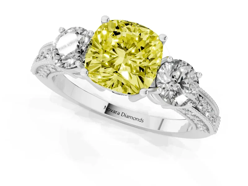 Fancy Yellow Cushion Cut Diamond Three-Stone Ring Set in White gold with Round Side Stones and Pavé Band