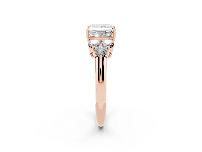 Princess Cut Diamond Cluster Ring Set in Rose gold with Round Accent Stones and Prong Setting on a Plain Band