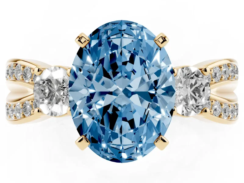 Fancy Blue Three-Stone Oval Cut Diamond Twist Band Ring Set in Yellow gold with Pavé Accents and Prong Setting