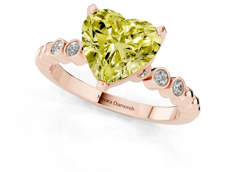 Fancy Yellow Heart Cut Diamond Solitaire Engagement Ring Set in Rose gold with Bezel Accents on Beaded Band
