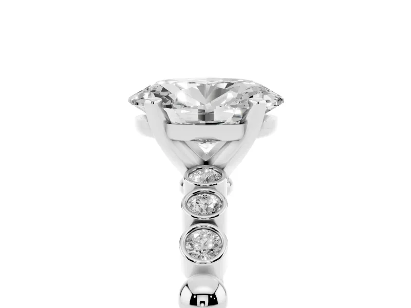 Oval Cut Diamond Solitaire Engagement Ring Set in Silver with Bezel Accents on Beaded Band