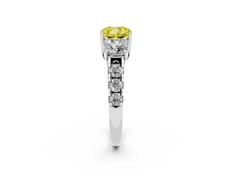 Fancy Yellow Cushion Cut Diamond Three-Stone Ring Set in White gold with Pavé Band