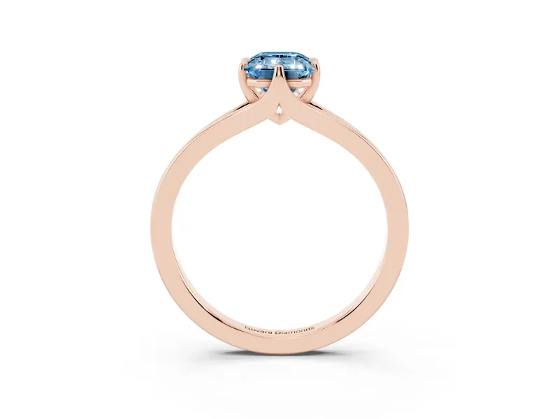 Fancy Blue Emerald Cut Diamond Solitaire Ring Set in Rose gold with Polished Tapered Band and Prong Setting