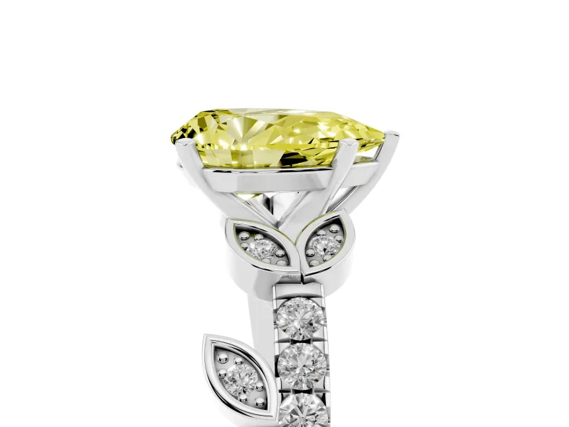 Fancy Yellow Pear Cut Diamond Solitaire Leaf-Inspired Ring Set in White gold with Pavé Band and Prong Setting