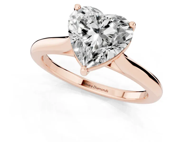 Heart Cut Diamond Solitaire Ring Set in Rose gold with Cathedral Band and Prong Setting
