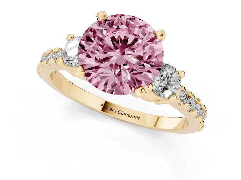 Fancy Pink Three-Stone Round Cut Diamond Pavé Band Ring Set in Yellow gold with Prong Setting