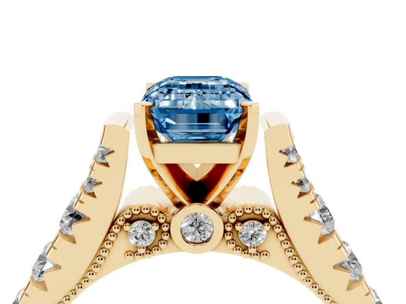 Fancy Blue Emerald Cut Diamond Classic Solitaire Ring Set in Yellow gold with Pavé Band and Prong Setting