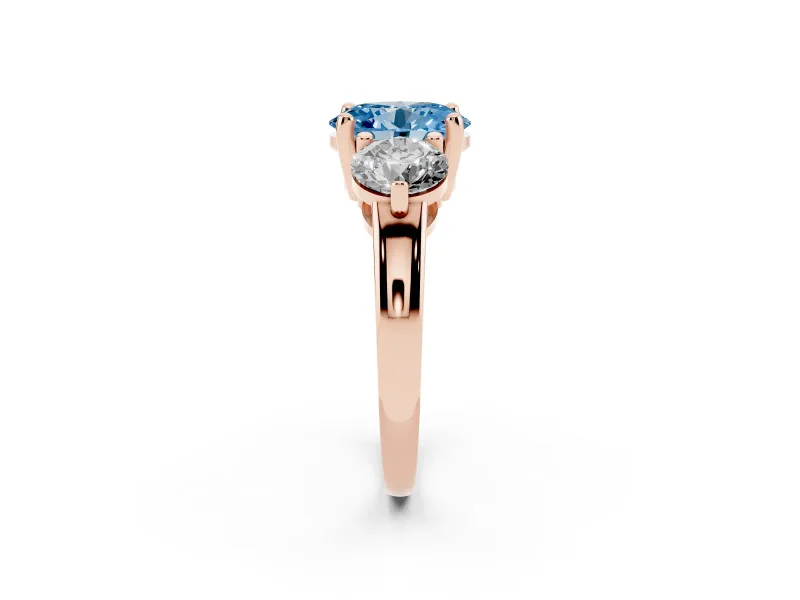 Fancy Blue Oval Cut Diamond Three-Stone Ring Set in Rose gold with Prong Setting and Classic Band