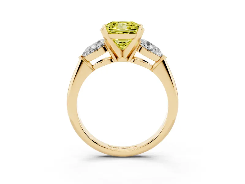 Fancy Yellow Three-Stone Princess Cut Diamond Ring Set in Yellow gold with Pear Side Stones and Prong Setting