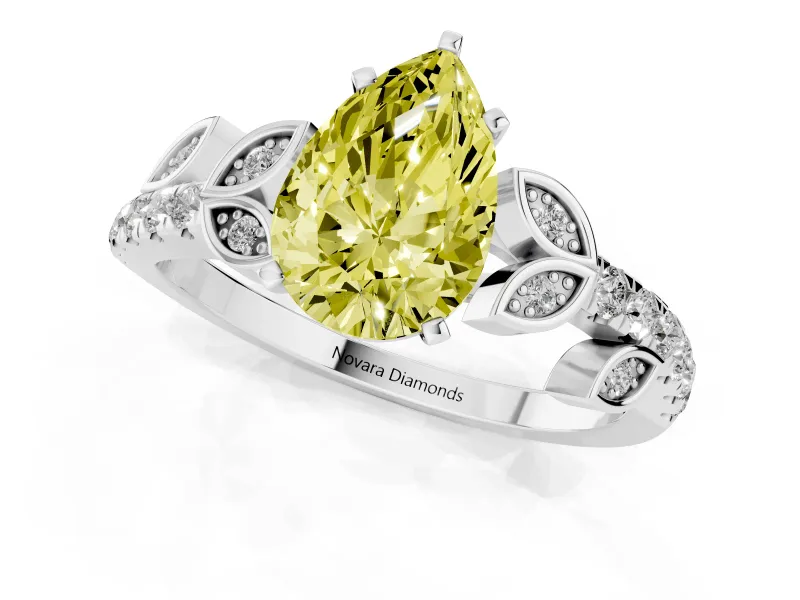Fancy Yellow Pear Cut Diamond Solitaire Leaf-Inspired Ring Set in Platinum with Pavé Band and Prong Setting