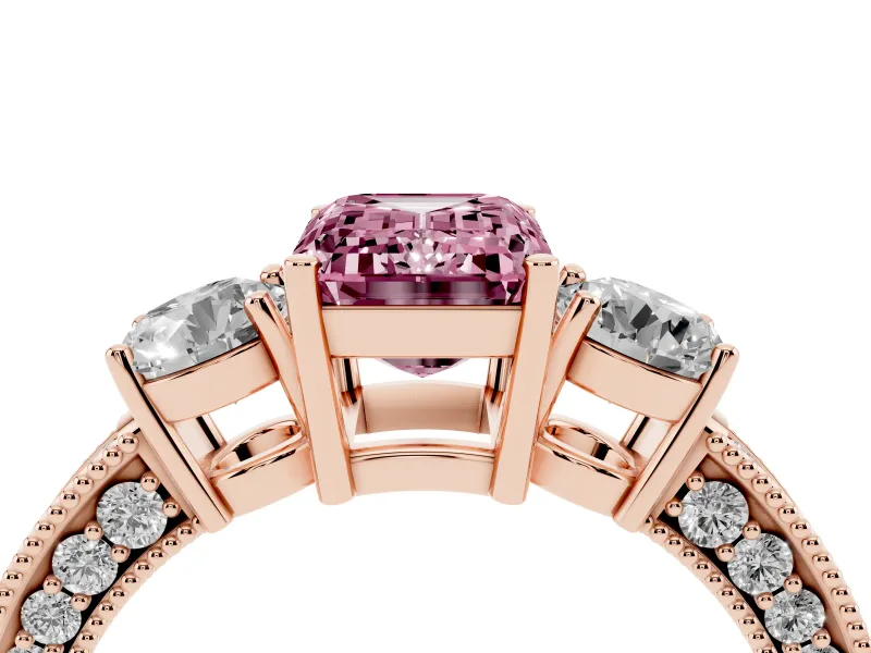 Fancy Pink Emerald Cut Diamond Three-Stone Ring Set in Rose gold with Round Side Stones and Pavé Band
