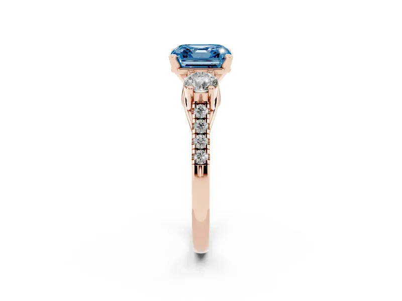 Fancy Blue Three-Stone Asscher Cut Diamond Pavé Band Ring Set in Rose gold with Prong-Set Trio