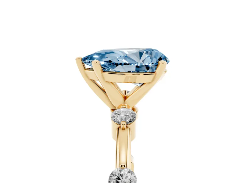Fancy Blue Pear Cut Diamond Solitaire Ring Set in Yellow gold with Bezel Set Side Stones and Prong Setting