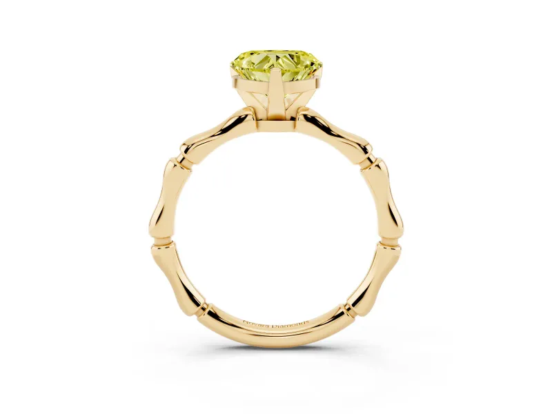 Fancy Yellow Heart Cut Diamond Solitaire Ring Set in Yellow gold with Bamboo Band and Prong Setting
