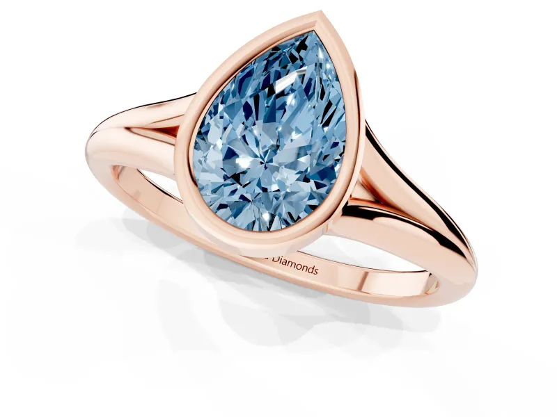 Fancy Blue Bezel Set Pear Cut Diamond Solitaire Ring Set in Rose gold with Tapered Band
