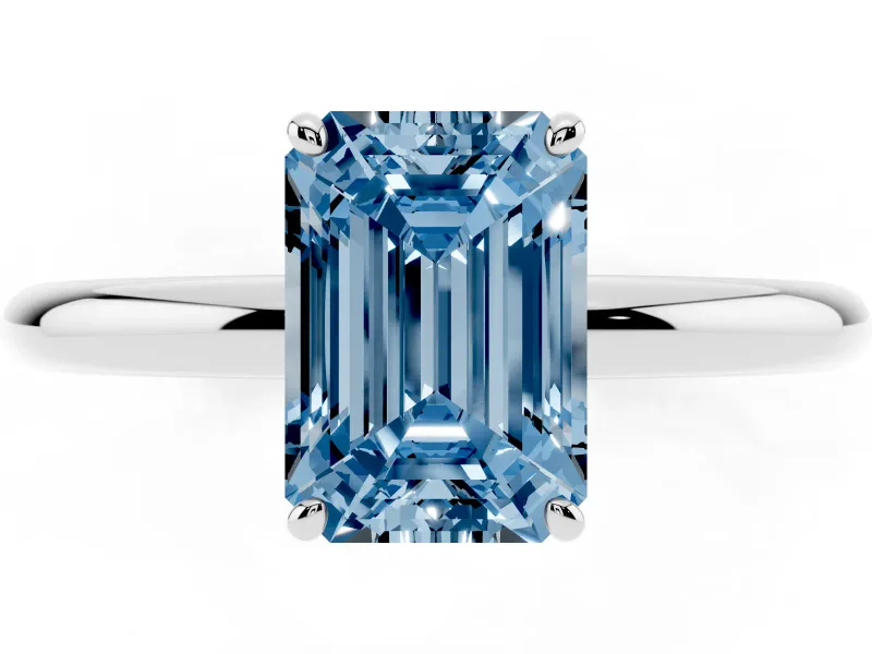 Fancy Blue Emerald Cut Diamond Solitaire Ring Set in White gold with Prong Setting on a Polished Plain Band