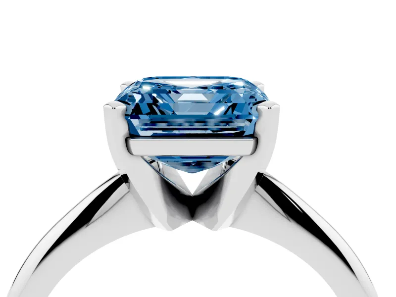 Fancy Blue Asscher Cut Diamond Solitaire Ring Set in Silver with Prong Setting on a Plain Round Band