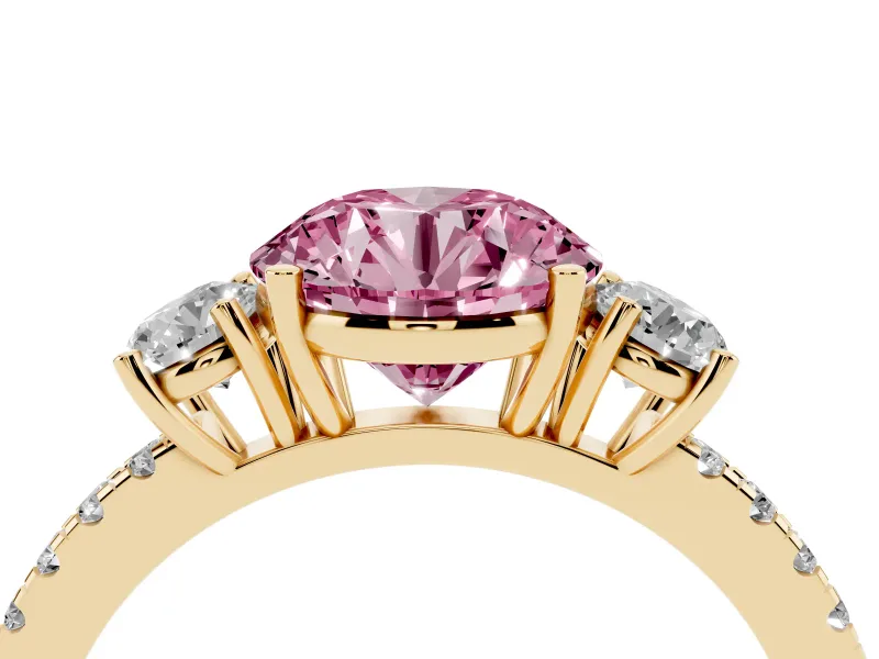Fancy Pink Round Cut Diamond Three-Stone Ring Set in Yellow gold with Pavé Band and Graduated Sides