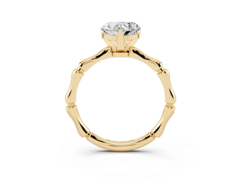 Heart Cut Diamond Solitaire Ring Set in Yellow gold with Bamboo Band and Prong Setting