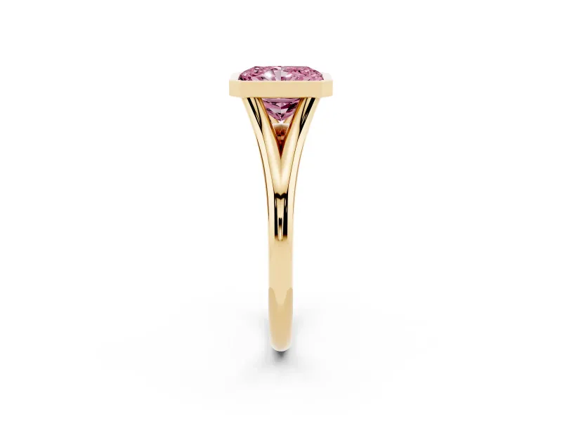Fancy Pink Bezel Set Radiant Cut Diamond Solitaire Ring Set in Yellow gold with Tapered Band