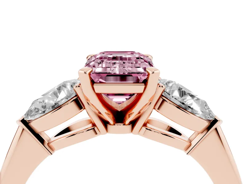 Fancy Pink Three-Stone Emerald Cut Diamond Ring Set in Rose gold with Pear Side Stones and Prong Setting
