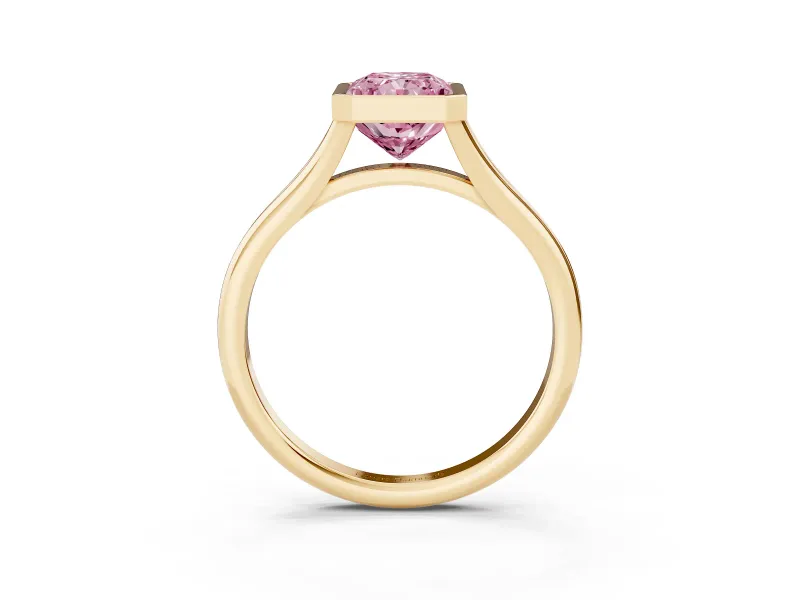 Fancy Pink Bezel Set Radiant Cut Diamond Solitaire Ring Set in Yellow gold with Tapered Band