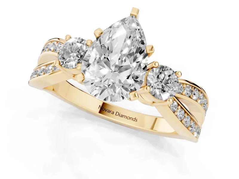 Three-Stone Pear Cut Diamond Twist Band Ring Set in Yellow gold with Pavé Accents and Prong Setting
