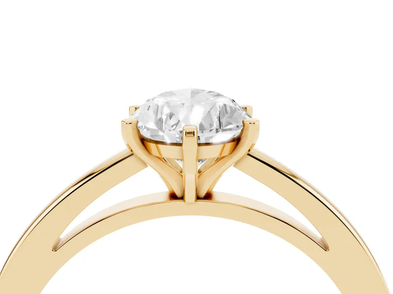 Pear Cut Diamond Solitaire Engagement Ring Set in Yellow gold with Prong Setting on a Classic Band