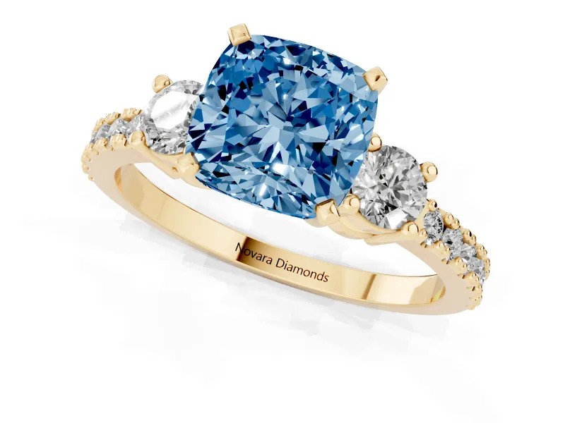 Cushion Cut Three Stone Engagement Ring Setting for a Fancy Blue Lab-Grown Diamond | Pavé Band | Yellow Gold