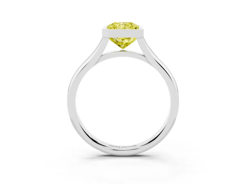 Fancy Yellow Bezel Set Radiant Cut Diamond Solitaire Ring Set in White gold with Tapered Band