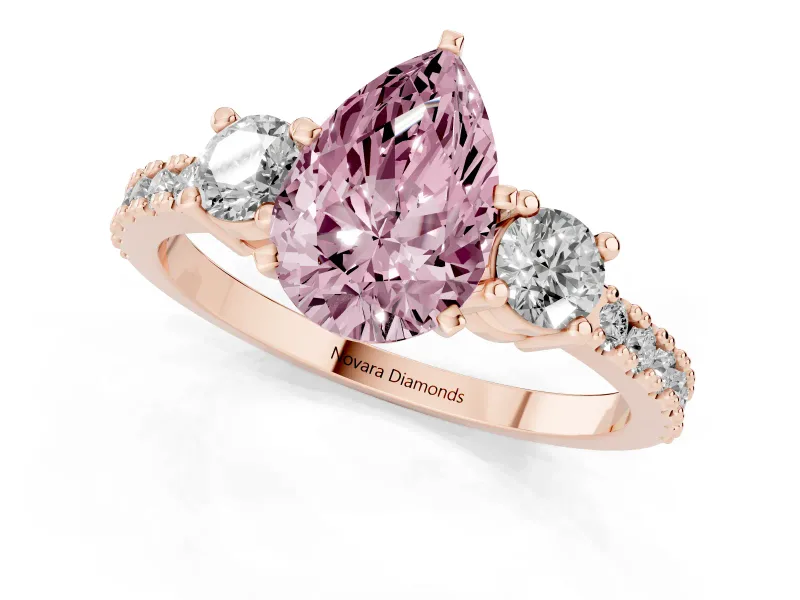 Fancy Pink Three-Stone Pear Cut Diamond Pavé Band Ring Set in Rose gold with Prong Setting