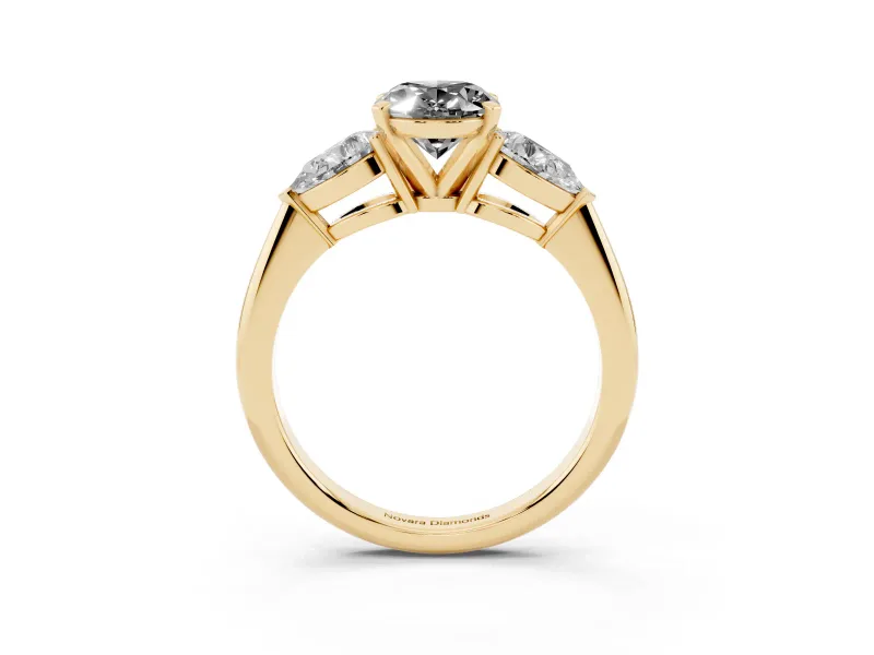 Fancy Black Three-Stone Oval Cut Diamond Ring Set in Yellow gold with Pear Side Stones and Prong Setting