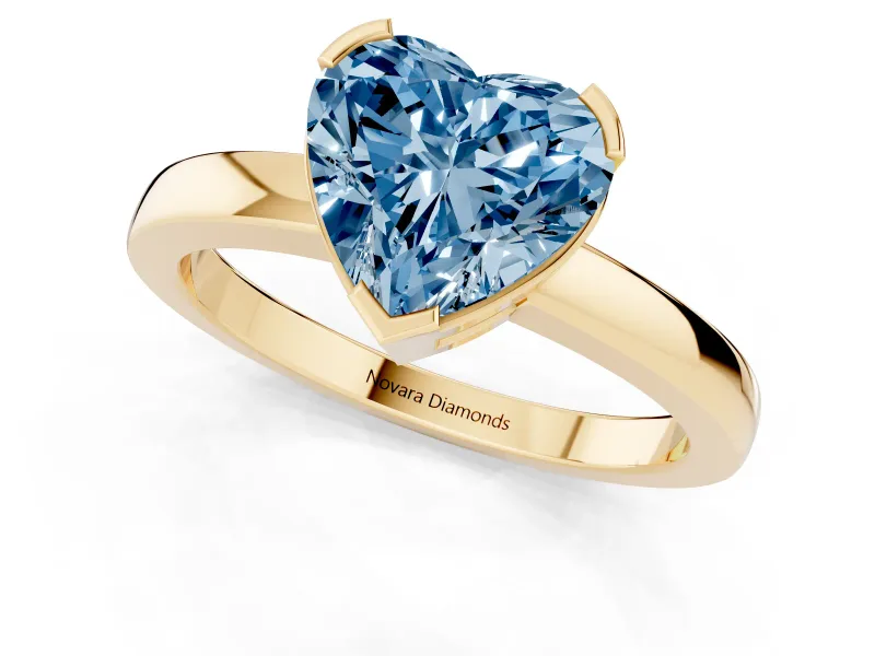 Fancy Blue Heart Cut Diamond Solitaire Ring Set in Yellow gold with Prong Head and Smooth Polished Band