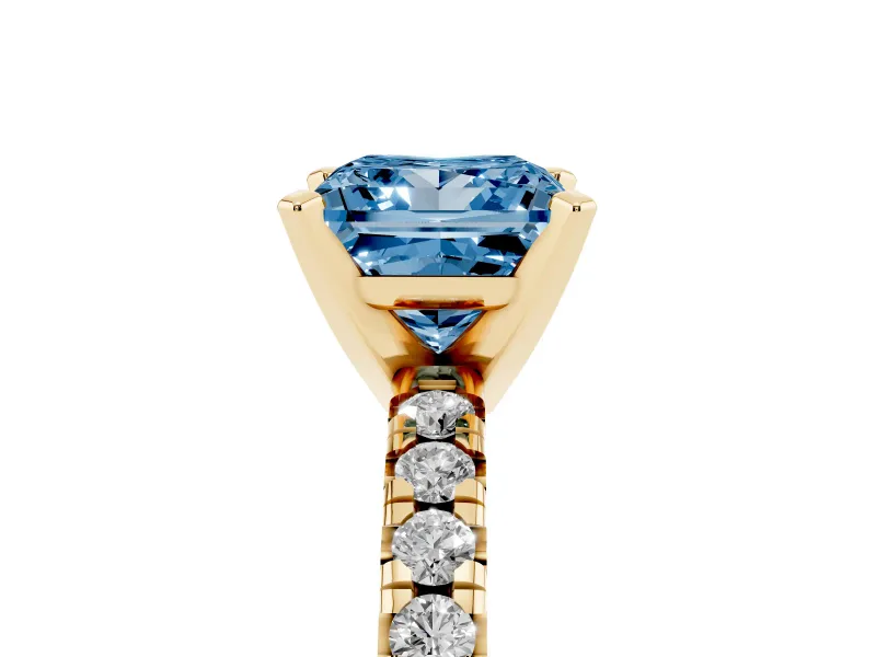 Fancy Blue Princess Cut Diamond Solitaire Pavé Engagement Ring Set in Yellow gold with Round Band and Prong Setting