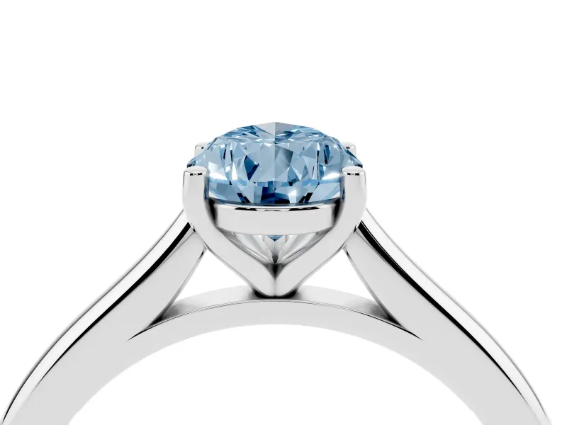 Fancy Blue Pear Cut Diamond Solitaire Ring Set in Silver with Cathedral Band and Prong Setting