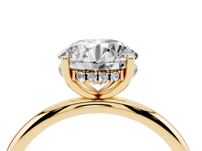 Round Cut Diamond Solitaire Engagement Ring Set in Yellow gold with Prong Setting and Polished Band