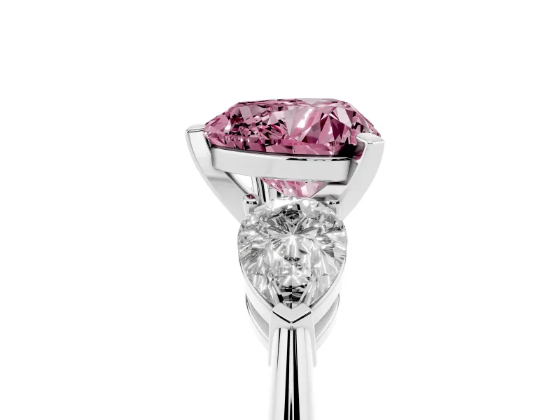 Fancy Pink Three-Stone Heart Cut Diamond Ring Set in White gold with Pear Side Stones and Prong Setting