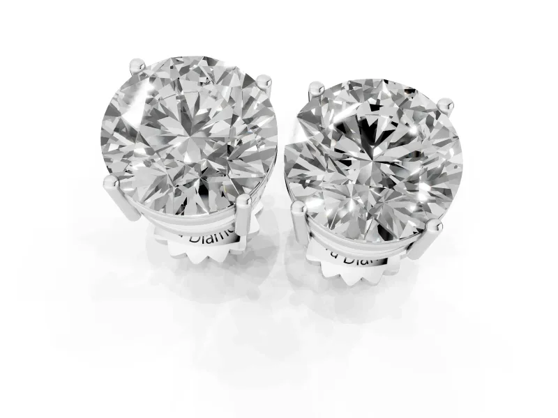 Round Cut Diamond Solitaire Stud Earrings Set in Platinum with Basket Setting