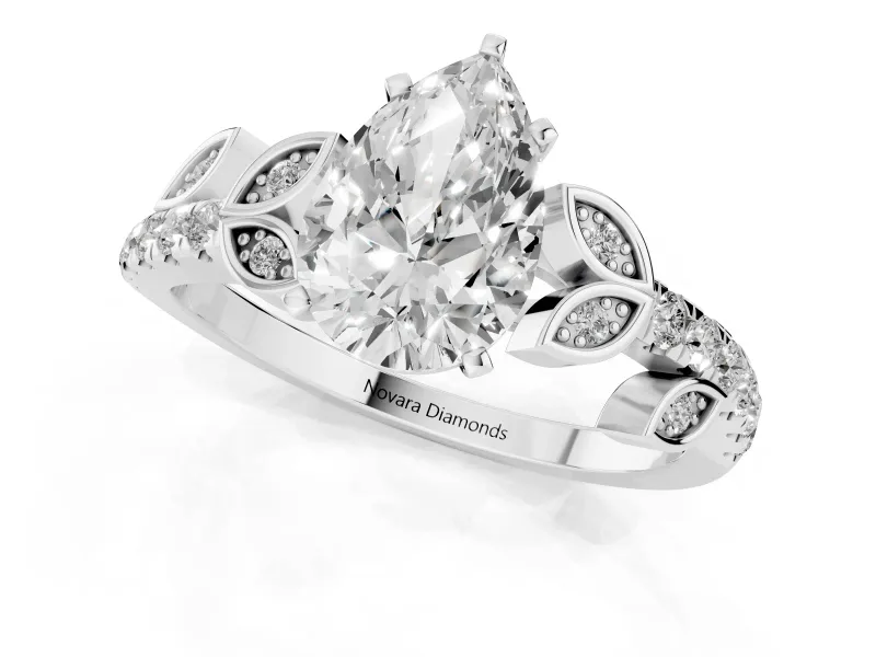 Pear Cut Diamond Solitaire Leaf-Inspired Ring Set in Platinum with Pavé Band and Prong Setting