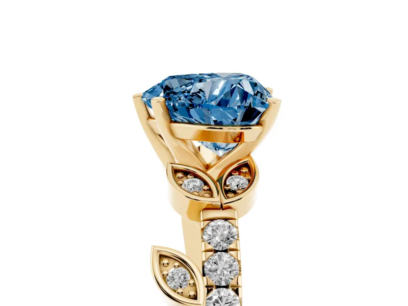Fancy Blue Heart Cut Diamond Solitaire Leaf-Inspired Ring Set in Yellow gold with Pavé Band and Prong Setting