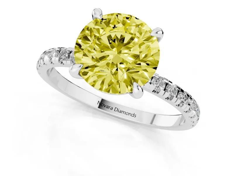 Fancy Yellow Round Cut Diamond Brilliant Solitaire Ring Set in Silver with Pavé Band and Prong Setting