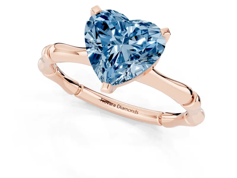 Fancy Blue Heart Cut Diamond Solitaire Ring Set in Rose gold with Bamboo Band and Prong Setting